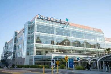 Cleveland Clinic building exterior with entrance and parked white van