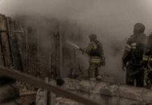 Double-Tap Horror Hits Kharkiv Aerial view of a neighborhood devastated by wildfire, showing burned structures and debris