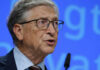 Grave Error Or Cover-Up? Bill Gates Grilled A man in a suit speaking at a conference with a microphone