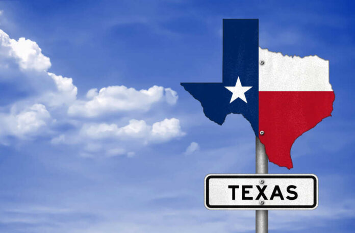 shutterstock533282275jpg Texas state outline with flag colors and a road sign indicating Texas