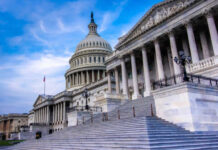 House Revolt Rattles White House The U.S. Capitol building with its iconic dome and steps under a blue sky