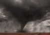 Tornado Terror Goes Viral, Facts Don’t A tornado forming in a dark, stormy sky over a field