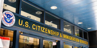 Entrance of the U.S. Citizenship and Immigration Services office with signage
