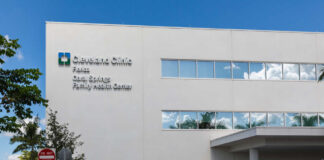 Cleveland Clinic building exterior with entrance and parked white van