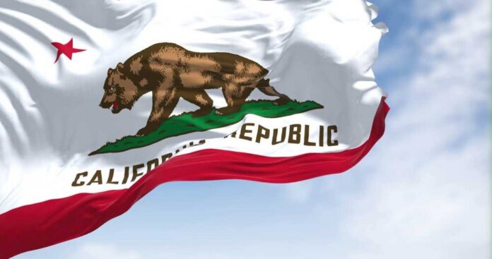 Close-up,View,Of,The,California,Flag,Waving.,California,Is,A California state flag featuring a bear and a star