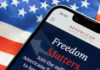 Does Campaign Cash Predict Election Wins? Smartphone displaying a political message over an American flag background