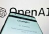 Twelve Tragedies, One Trial—OpenAI Exposed Close-up of a smartphone displaying the ChatGPT interface with the OpenAI logo in the background