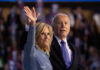 Viral Clip Hijacks Jill Biden’s Moment A couple waving at a crowd during a political event