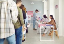 Shock Move Targets Millions Of Voters People waiting in line at a polling station to cast their votes