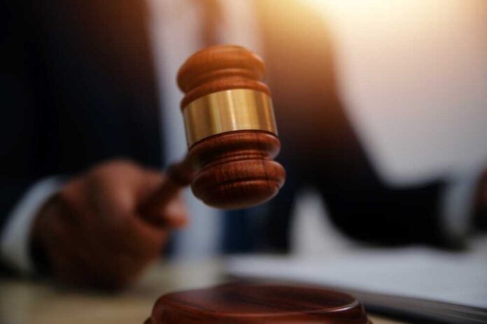 Law,Theme,,Gavel,Or,Mallet,Of,The,Judge,,Lawyer,Enforcement A judge's gavel being raised in a courtroom setting