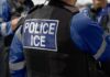ICE Refuses Virginia’s New Mask Rule Close-up of a police officer's vest with 'POLICE ICE' label