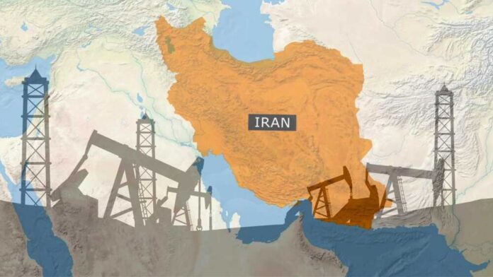 Conceptual,Map,Of,Iran,Overlaid,With,Silhouettes,Of,Oil,Pumpjacks Map of Iran highlighting oil production areas with oil rigs in the foreground