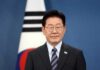 South Korea Probes World Cup Collapse Man in suit with glasses standing before South Korean flag