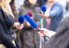 Reporter Privilege Faces Major Court Test Reporters holding microphones during an interview