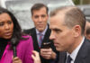 Hunter Biden Wins $1.7 Million Judgment A journalist interviewing a political figure outdoors