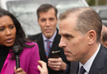 Hunter Biden Wins $1.7 Million Judgment A journalist interviewing a political figure outdoors