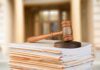 Boxcar Deaths Expose D.C. Breakdown judge's gavel resting on a stack of case files
