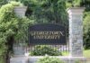 Lawmakers Probe Georgetown Foreign Funding ornate campus entrance sign on wrought iron gate