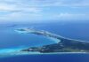 New Advisory Warns U.S. Tourists Aerial view of a tropical island surrounded by blue ocean waters