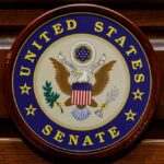 Stunned Senate Meltdown Over Fauci Silence United States Senate seal on a wooden wall