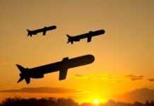 Ceasefire Shattered? Missiles Roar Over Iran Silhouetted missiles flying against a sunset backdrop