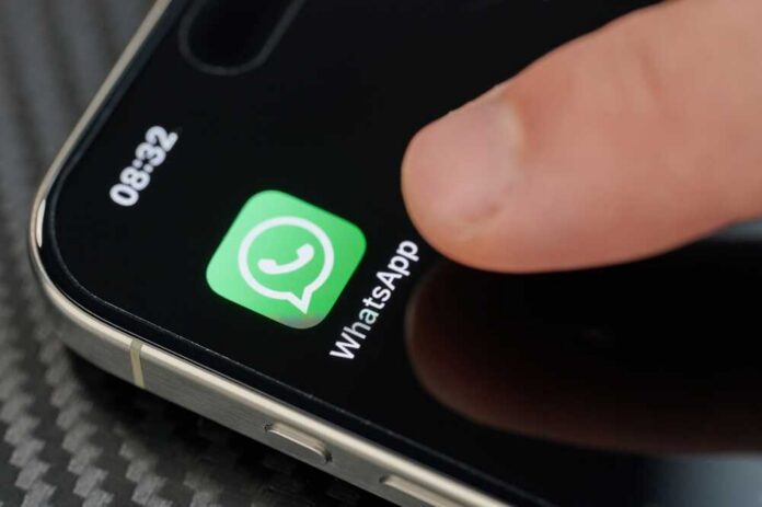 New,York,,Usa,-,January,24,,2024:,Touching,Top,Open Finger tapping the WhatsApp icon on a smartphone screen