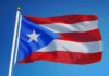 Island Water Crisis Deepens Puerto Rico flag waving on a flagpole