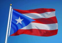 Island Water Crisis Deepens Puerto Rico flag waving on a flagpole