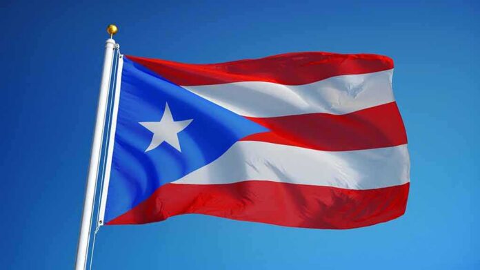 shutterstock_478586320 Puerto Rico flag waving on a flagpole