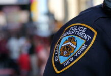No Arrests After Brooklyn Shooting Close-up of a New York City police badge on a uniform