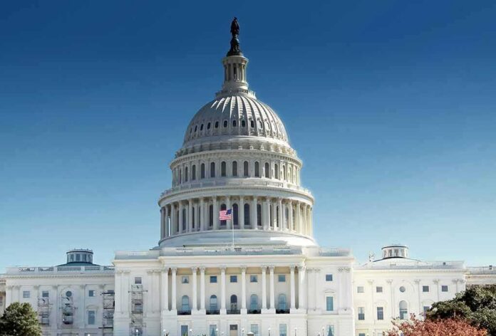 shutterstock_1034821033 United States Capitol building with dome under clear blue sky