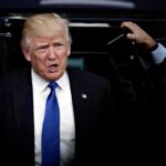 Trump Fires Back At America First Rebels man in suit stepping out of a vehicle