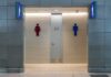 Privacy Fight Explodes Over Single-Sex Spaces Public restroom entrance with male and female symbols