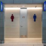 Public restroom entrance with male and female symbols