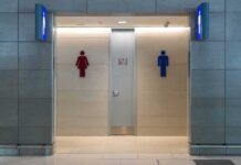 Privacy Fight Explodes Over Single-Sex Spaces Public restroom entrance with male and female symbols