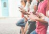 Democrats Test Drive Youth Whisperers Group of people using smartphones outdoors