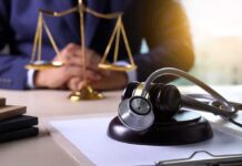 Trust Shattered Inside Army Clinics Gavel with stethoscope on desk near scales of justice