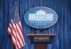 Surprise Contender Circles White House Mic White House press briefing podium and US flag