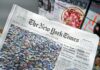 The New York Times newspaper on a magazine stand