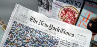 The New York Times newspaper on a magazine stand