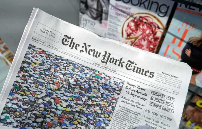 shutterstock_1181152972 The New York Times newspaper on a magazine stand
