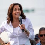 Midterm Math Terrifies Democrats woman speaking into a microphone at an outdoor event