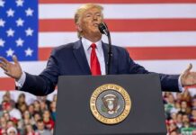Power Play: Trump Puts Johnson On Top speaker at podium with U.S. flag backdrop