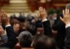 Raised hands in a formal meeting or vote
