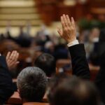 Parents’ Rights Brawl Roils Virginia Raised hands in a formal meeting or vote