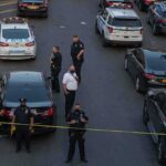 MSG Concert Death Gets Final Ruling Police officers secure a street with patrol cars and yellow tape