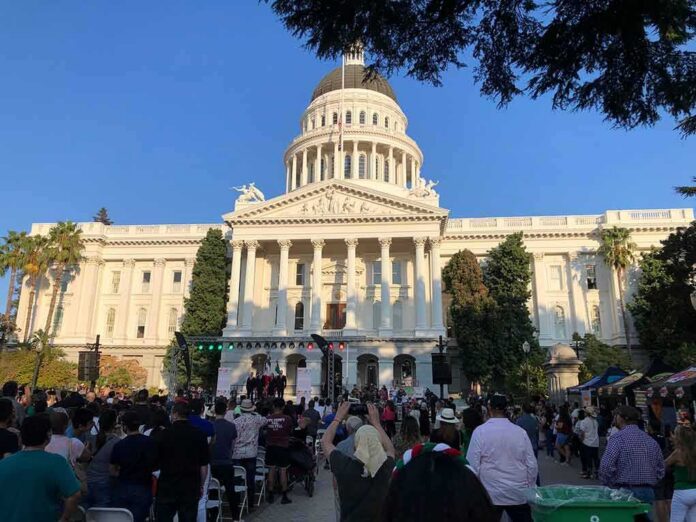 shutterstock_2202437059 Crowd gathers before a neoclassical capitol building with dome