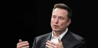 man in a suit speaking with hand gestures