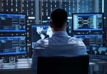 Trading Firms Pay For First Dibs On Trump IT professional monitors multiple screens in a server room