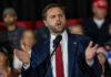 Gym Showdown Dares The Vice President Man in suit speaking at a podium